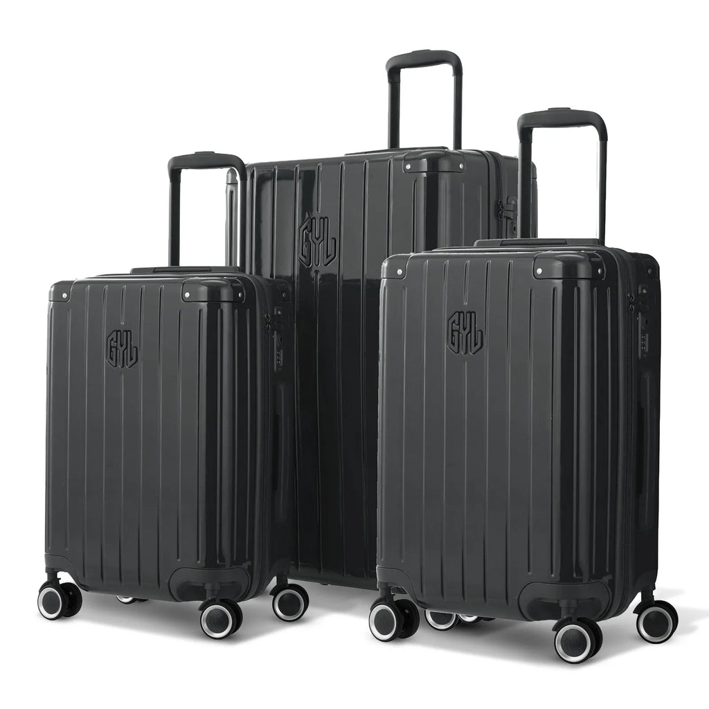 Trio de valises rigides GYL Intemporelle gris foncé avec coques nervurées et poignées télescopiques.  #couleur_gris foncé