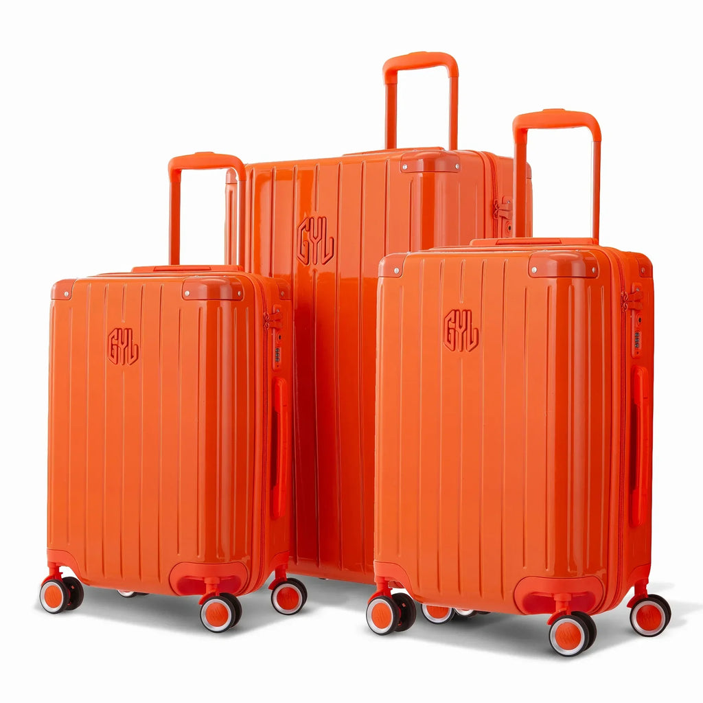 Trio de valises rigides GYL Intemporelle orange avec coques nervurées et poignées télescopiques.  #couleur_orange