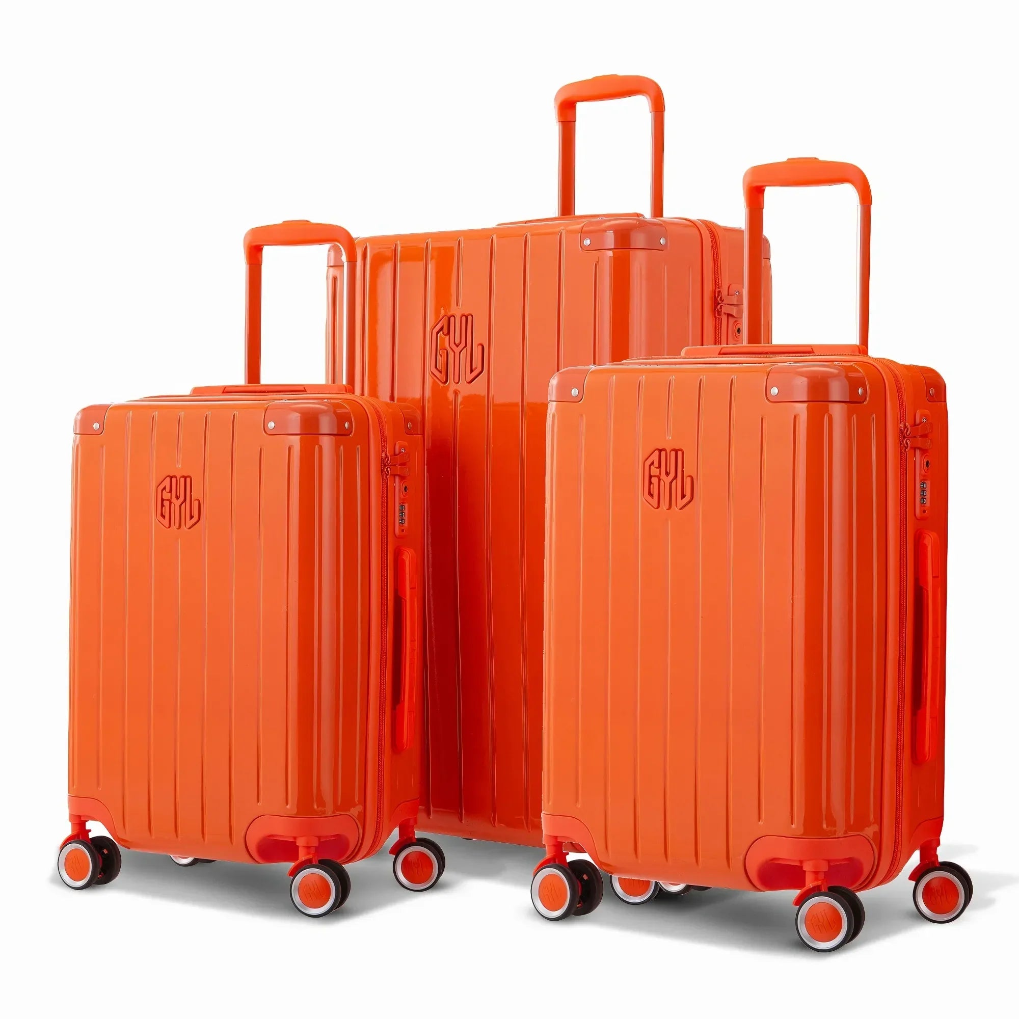 Trio de valises rigides GYL Intemporelle orange avec coques nervurées et poignées télescopiques.  #couleur_orange