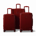 Trois valises rigides GYL Intemporelle rouge foncé, format cabine et soute, avec poignée trolley déployée. #couleur_rouge foncé