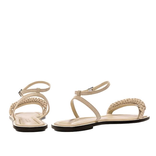 Rovena nude flat sandals featuring removable ankle strap and braided design for a stylish summer look.