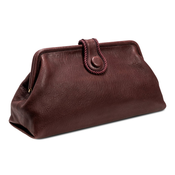 Burgundy in a shade of dark cherry leather handbag with a rope closure on a white background