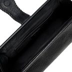 Close-up of a black leather bag with a white interior and card slots