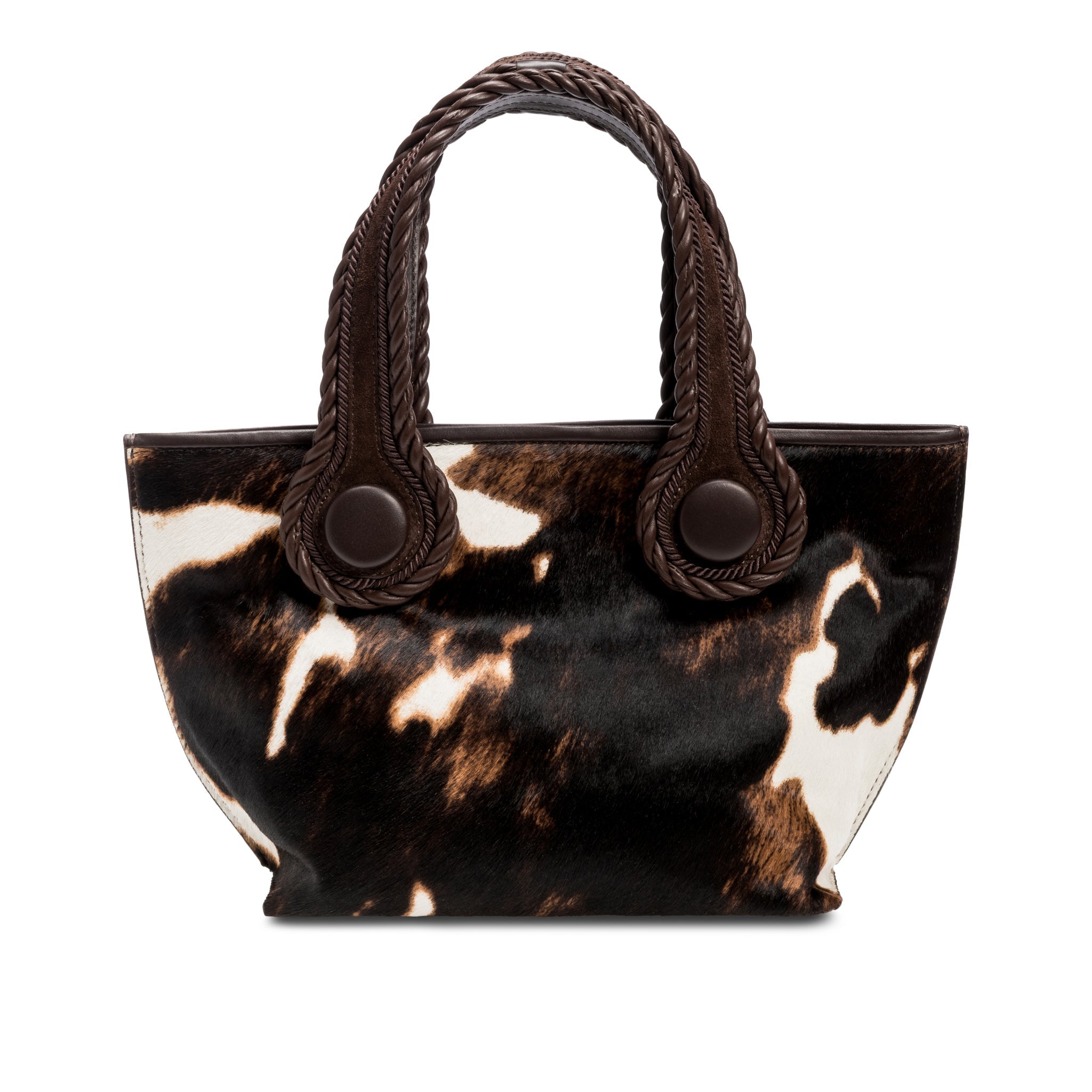 Dark brown and cream cow print pattern small tote bag with dark brown rope handles on a white background.