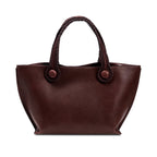 Burgundy leather in a shade of dark cherry tote bag with rope handles on a white background