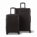 Deux valises rigides GYL Intemporelle noir, 2 formats, avec poignée trolley déployée. #couleur_noir
