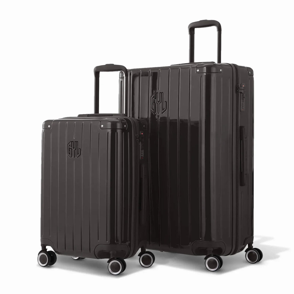Duo de valises rigides GYL Intemporelle noir avec coques nervurées et poignées télescopiques. #couleur_noir