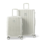Deux valises rigides GYL Intemporelle sable, format cabine et soute, avec poignée trolley déployée. #couleur_sable