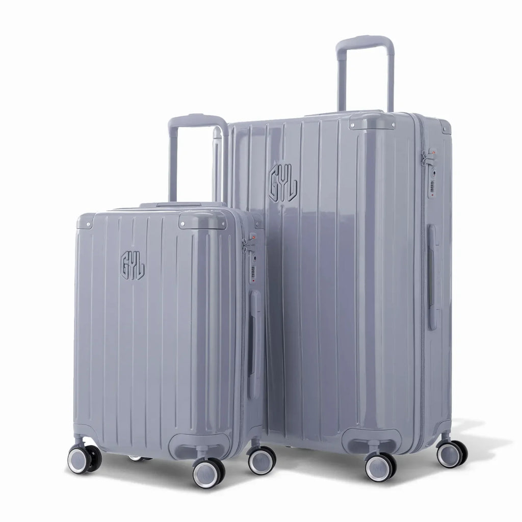 Duo de valises rigides GYL Intemporelle argent avec coques nervurées et poignées télescopiques. #couleur_argent