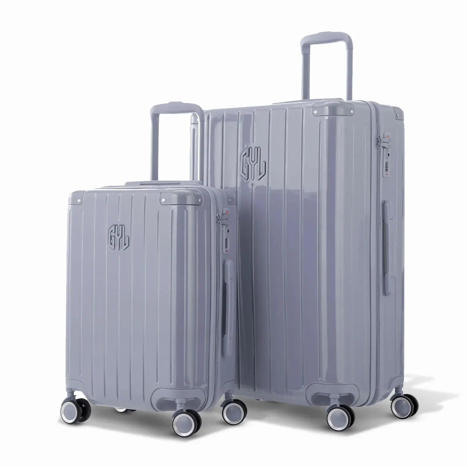 Duo de valises rigides GYL Intemporelle argent avec coques nervurées et poignées télescopiques. #couleur_argent
