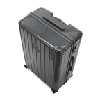 Vue en angle de la valise rigide GYL Intemporelle gris foncé avec coins renforcés et coque nervurée brillante. #couleur_gris foncé