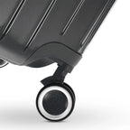 Roue double 360° de la valise GYL Intemporelle gris foncé avec gravure du logo GYL sur le moyeu. #couleur_gris foncé