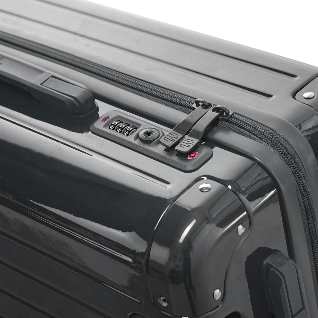 Fermeture à combinaison TSA et double curseur zippé GYL sur la valise rigide gris foncé Intemporelle. #couleur_gris foncé