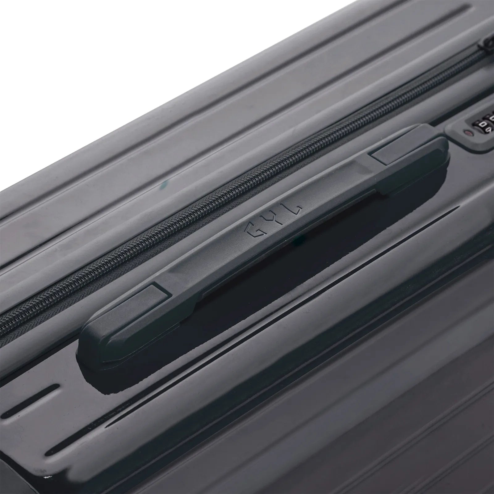 Poignée supérieure rigide de la valise GYL Intemporelle gris foncé avec logo embossé sur le dessus. #couleur_gris foncé