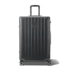 Vue avant de la valise rigide GYL Intemporelle gris foncé, logo embossé et roulettes 360 degrés. #couleur_gris foncé