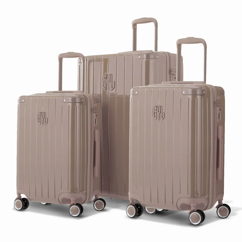 Trio de valises rigides GYL Intemporelle orange poudré avec coques nervurées et poignées télescopiques.  #couleur_orange poudre
