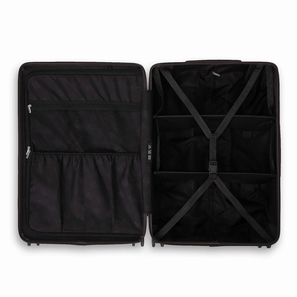 Intérieur compartimenté de la valise GYL Intemporelle noir avec sangles croisées et poches filet. #couleur_noir