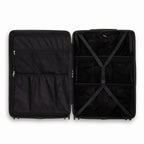 Intérieur compartimenté de la valise GYL Intemporelle noir avec sangles croisées et poches filet. #couleur_noir