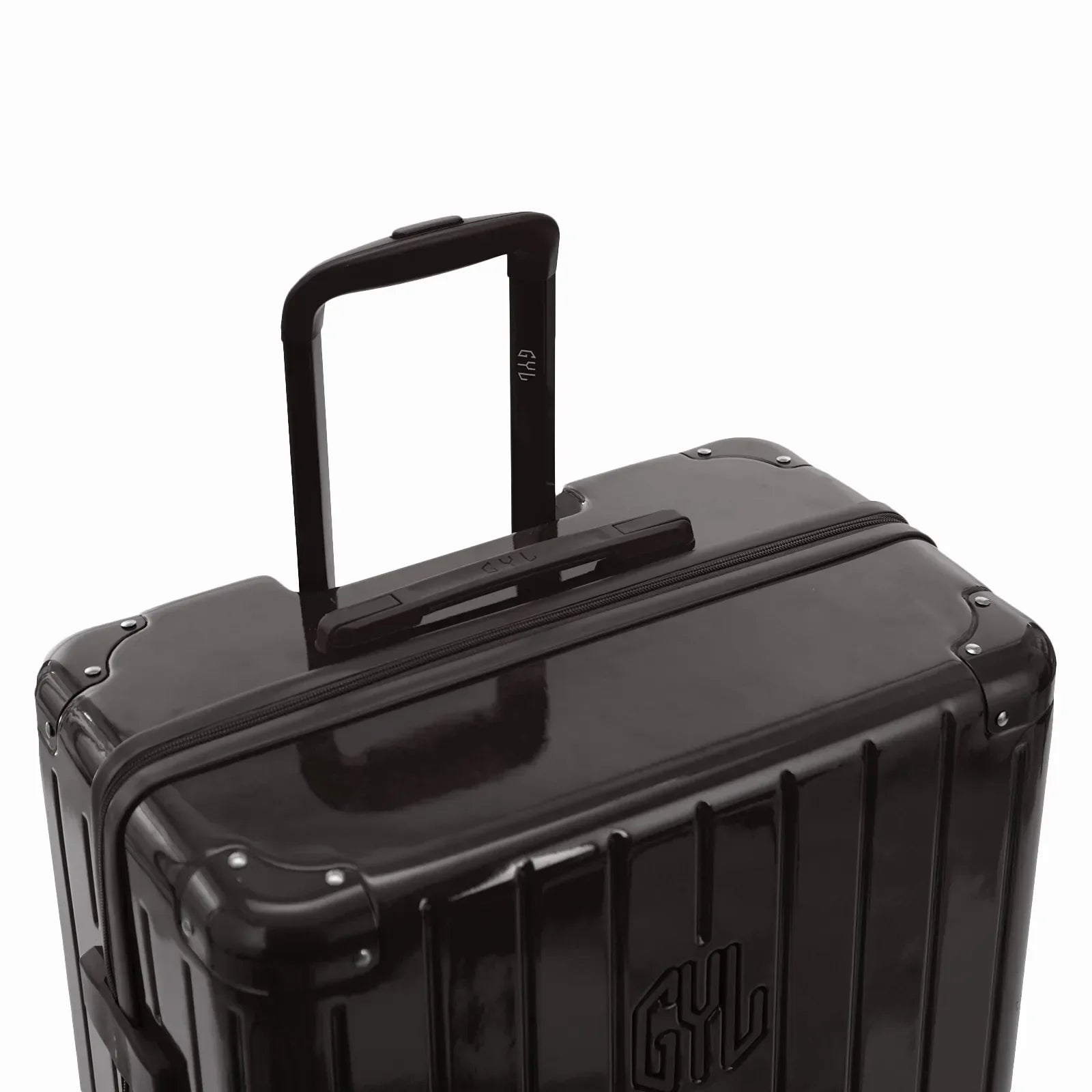 Poignée trolley télescopique GYL déployée sur la valise Intemporelle noir en polycarbonate. #couleur_noir