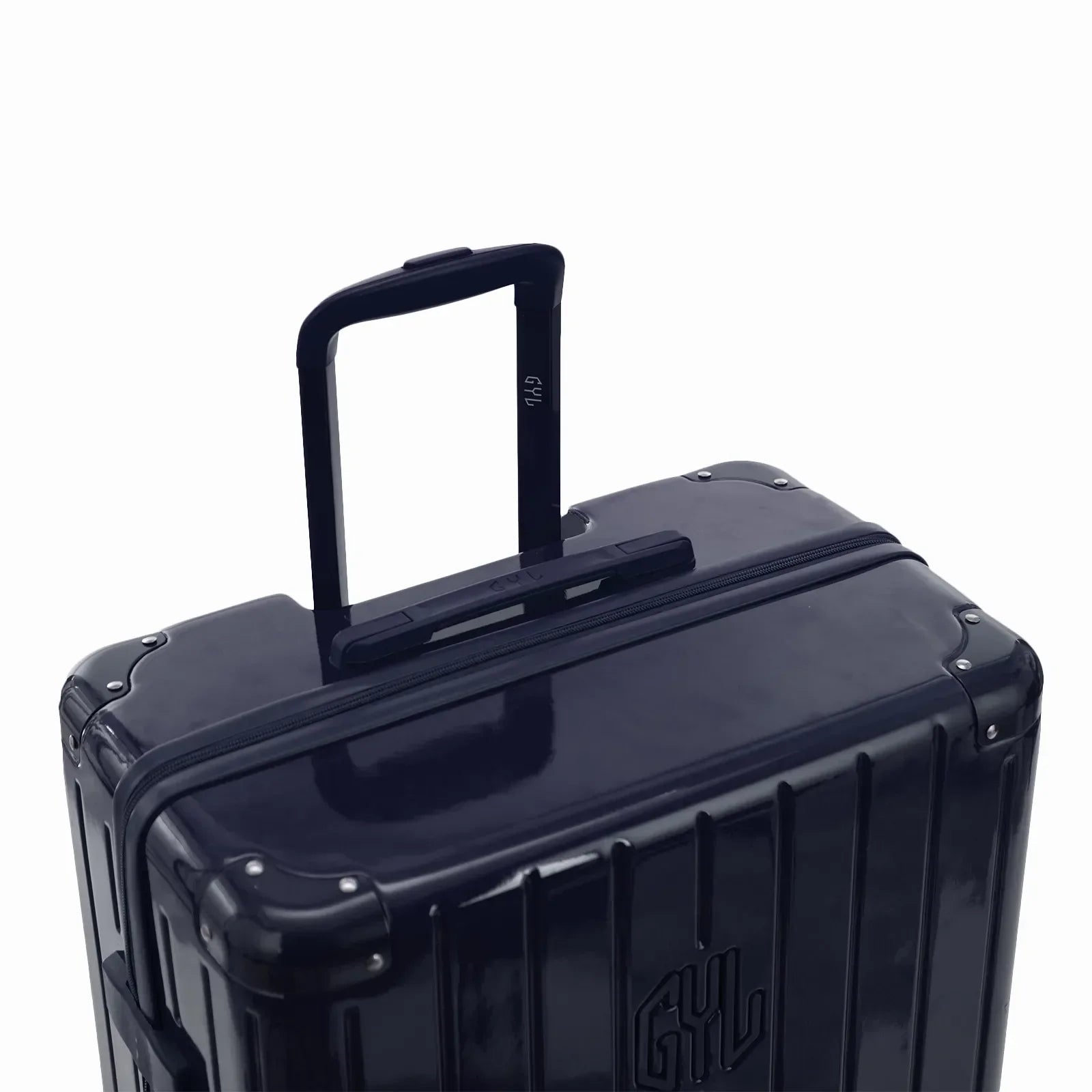 Poignée trolley télescopique GYL déployée sur la valise Intemporelle marine en polycarbonate. #couleur_marine