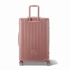 Vue arrière de la valise rigide GYL Intemporelle rose gold avec poignées intégrées et roulettes pivotantes. #couleur_rose gold