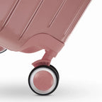 Roue double 360° de la valise GYL Intemporelle rose gold avec gravure du logo GYL sur le moyeu. #couleur_rose gold