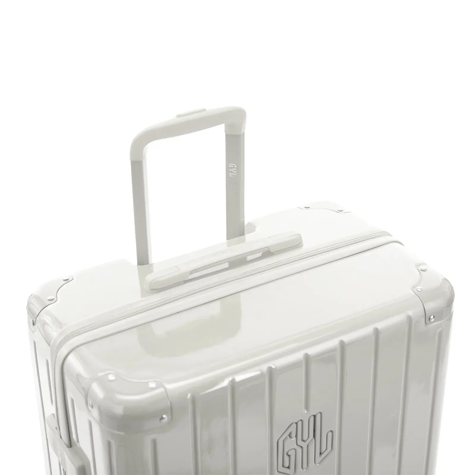 Poignée trolley télescopique GYL déployée sur la valise Intemporelle sable en polycarbonate. #couleur_sable