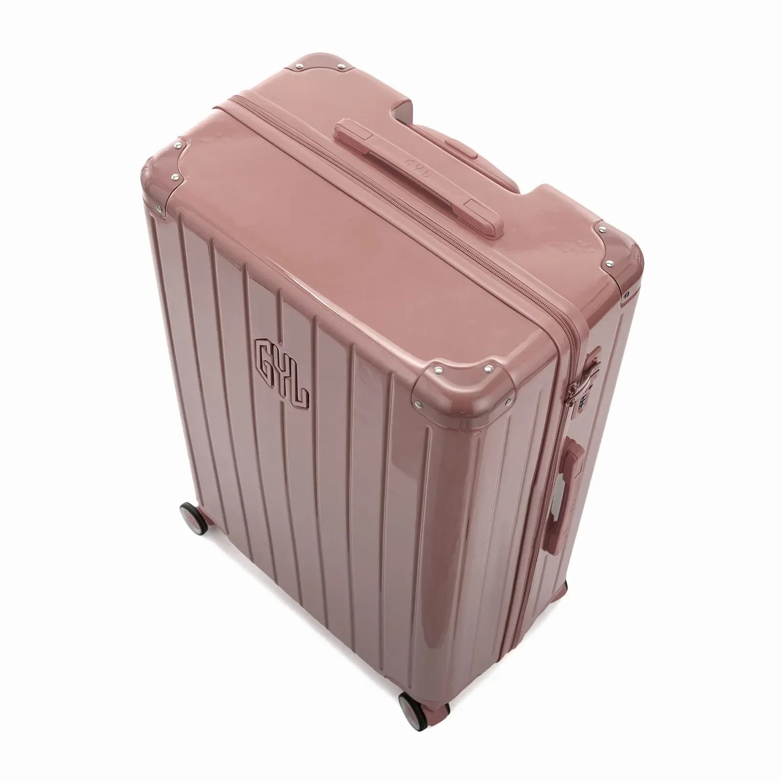 Vue en angle de la valise rigide GYL Intemporelle rose gold avec coins renforcés et coque nervurée brillante. #couleur_rose gold
