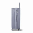 Vue latérale de la valise rigide GYL Intemporelle argent avec poignée télescopique et fermeture TSA. #couleur_argent