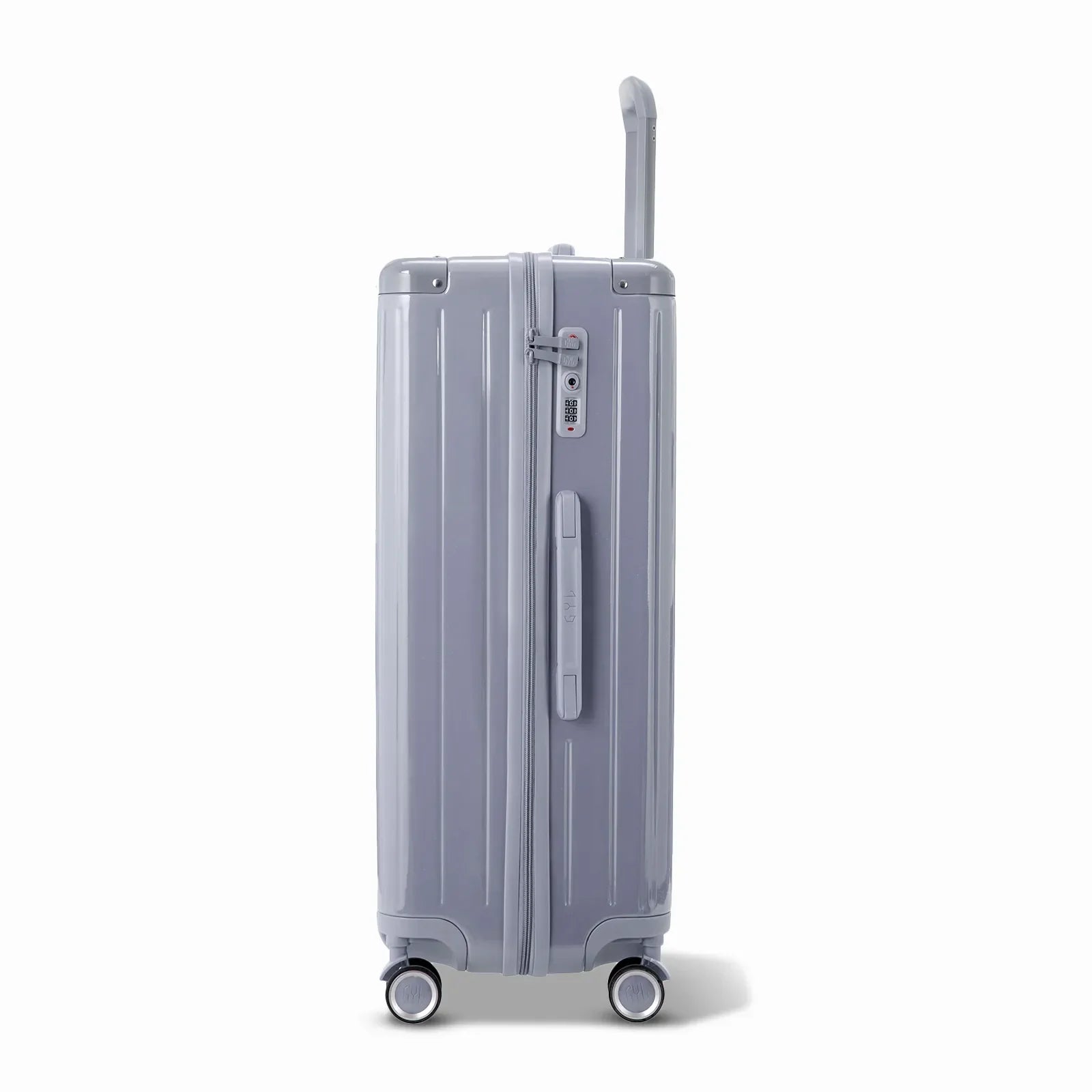 Vue latérale de la valise rigide GYL Intemporelle argent avec poignée télescopique et fermeture TSA. #couleur_argent