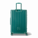 Vue arrière de la valise rigide GYL Intemporelle vert d'eau avec poignées intégrées et roulettes pivotantes. #couleur_vert