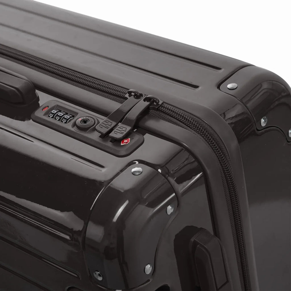 Fermeture à combinaison TSA et double curseur zippé GYL sur la valise rigide noir Intemporelle. #couleur_noir