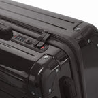Fermeture à combinaison TSA et double curseur zippé GYL sur la valise rigide noir Intemporelle. #couleur_noir