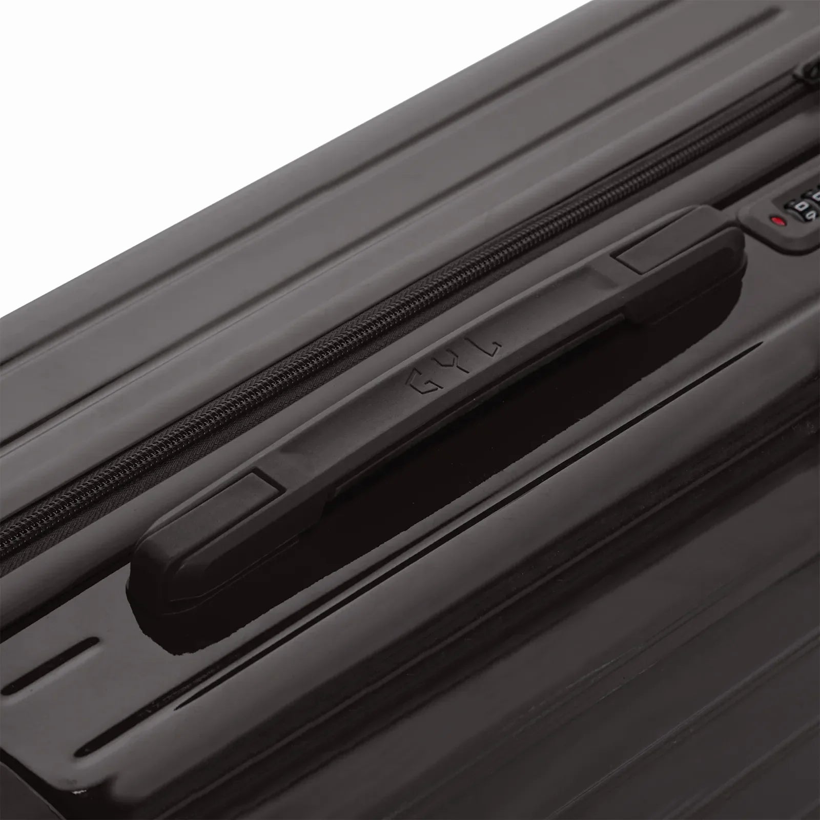 Poignée supérieure rigide de la valise GYL Intemporelle noir avec logo embossé sur le dessus. #couleur_noir