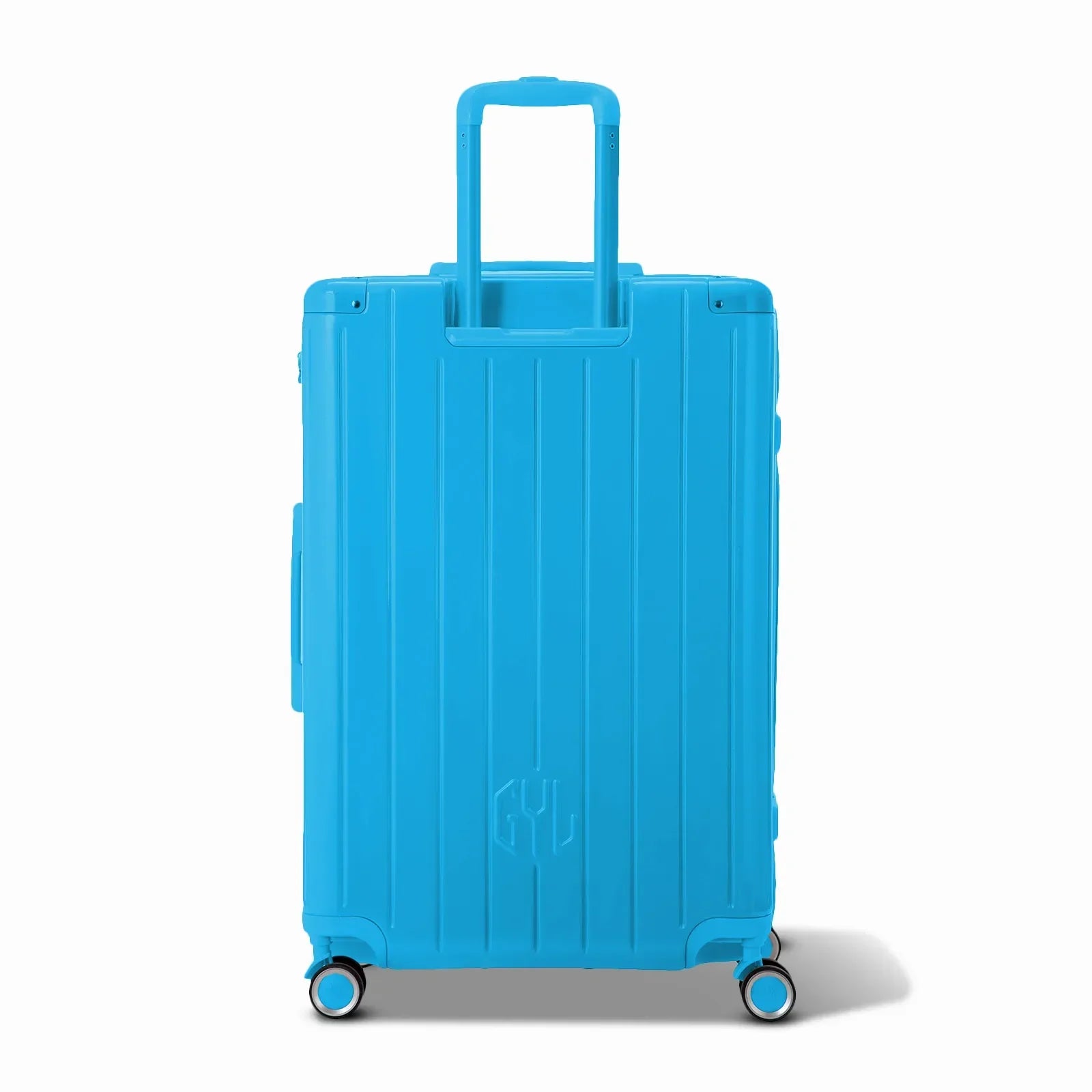 Vue arrière de la valise rigide GYL Intemporelle menthe avec poignées intégrées et roulettes pivotantes. #couleur_menthe