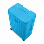 Vue en angle de la valise rigide GYL Intemporelle menthe avec coins renforcés et coque nervurée brillante. #couleur_menthe