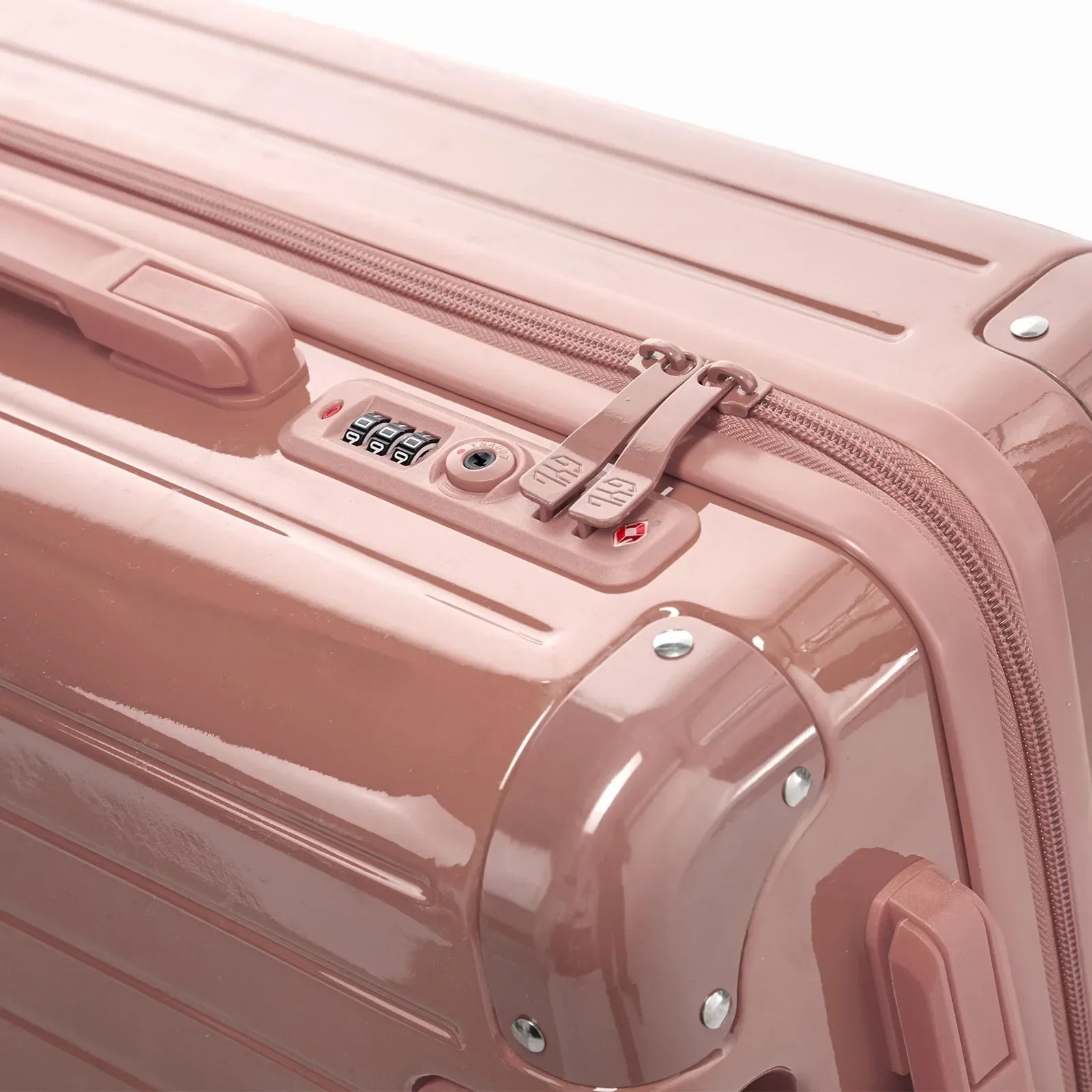 Fermeture à combinaison TSA et double curseur zippé GYL sur la valise rigide rose gold Intemporelle. #couleur_rose gold