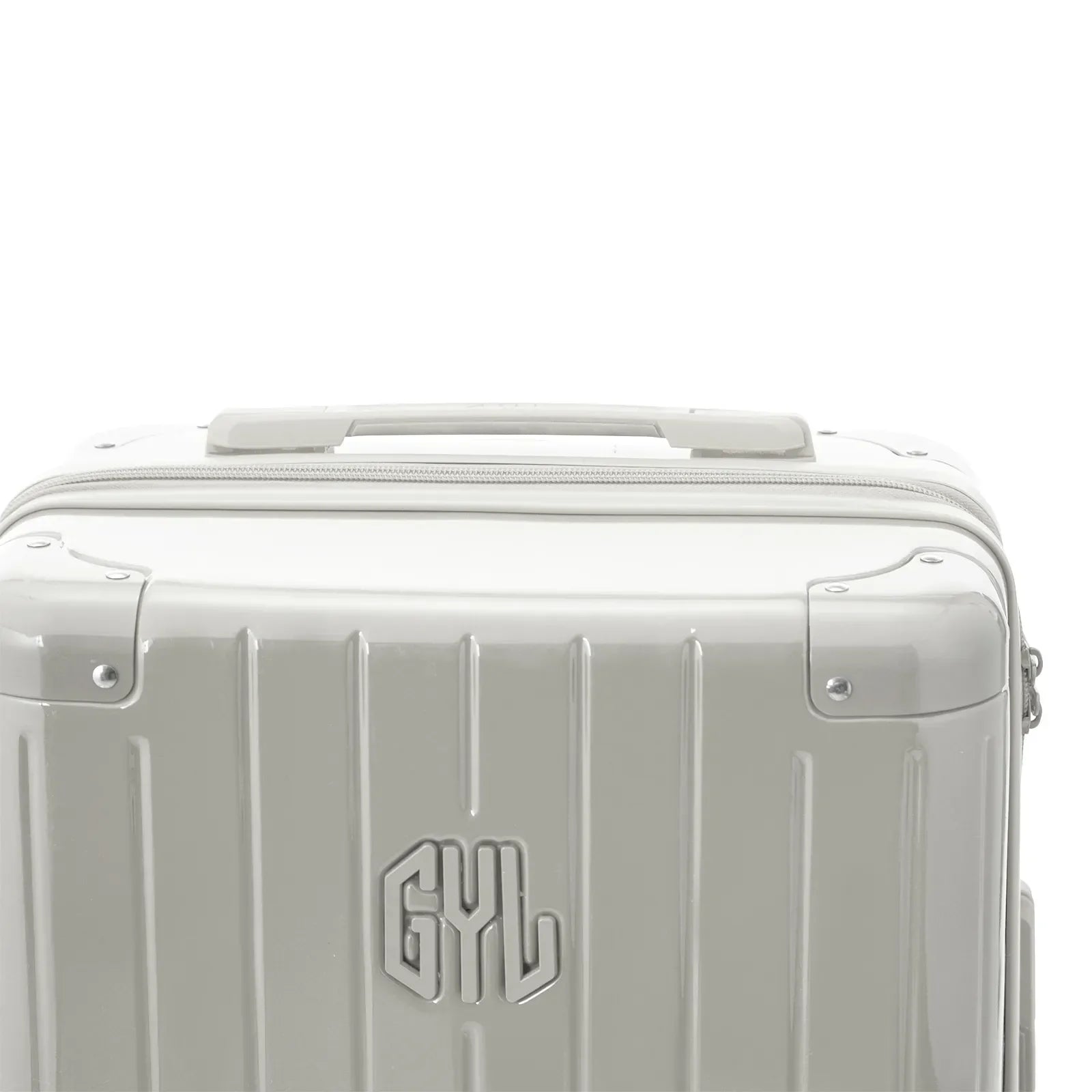 Poignée supérieure rigide de la valise GYL Intemporelle sable avec logo embossé sur le dessus. #couleur_sable