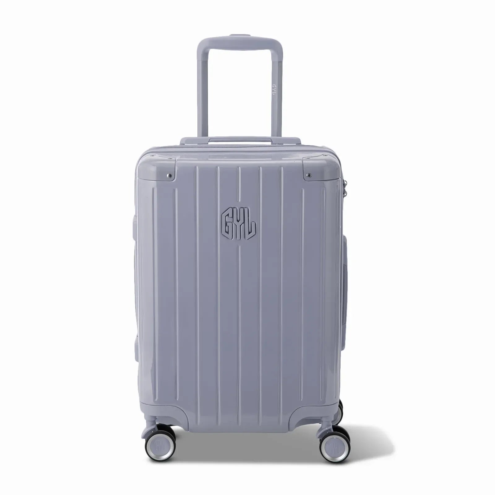 Vue avant de la valise rigide GYL Intemporelle argent, logo embossé et roulettes 360 degrés. #couleur_argent
