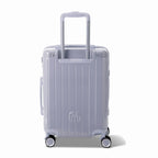 Vue arrière de la valise rigide GYL Intemporelle argent avec poignées intégrées et roulettes pivotantes. #couleur_argent