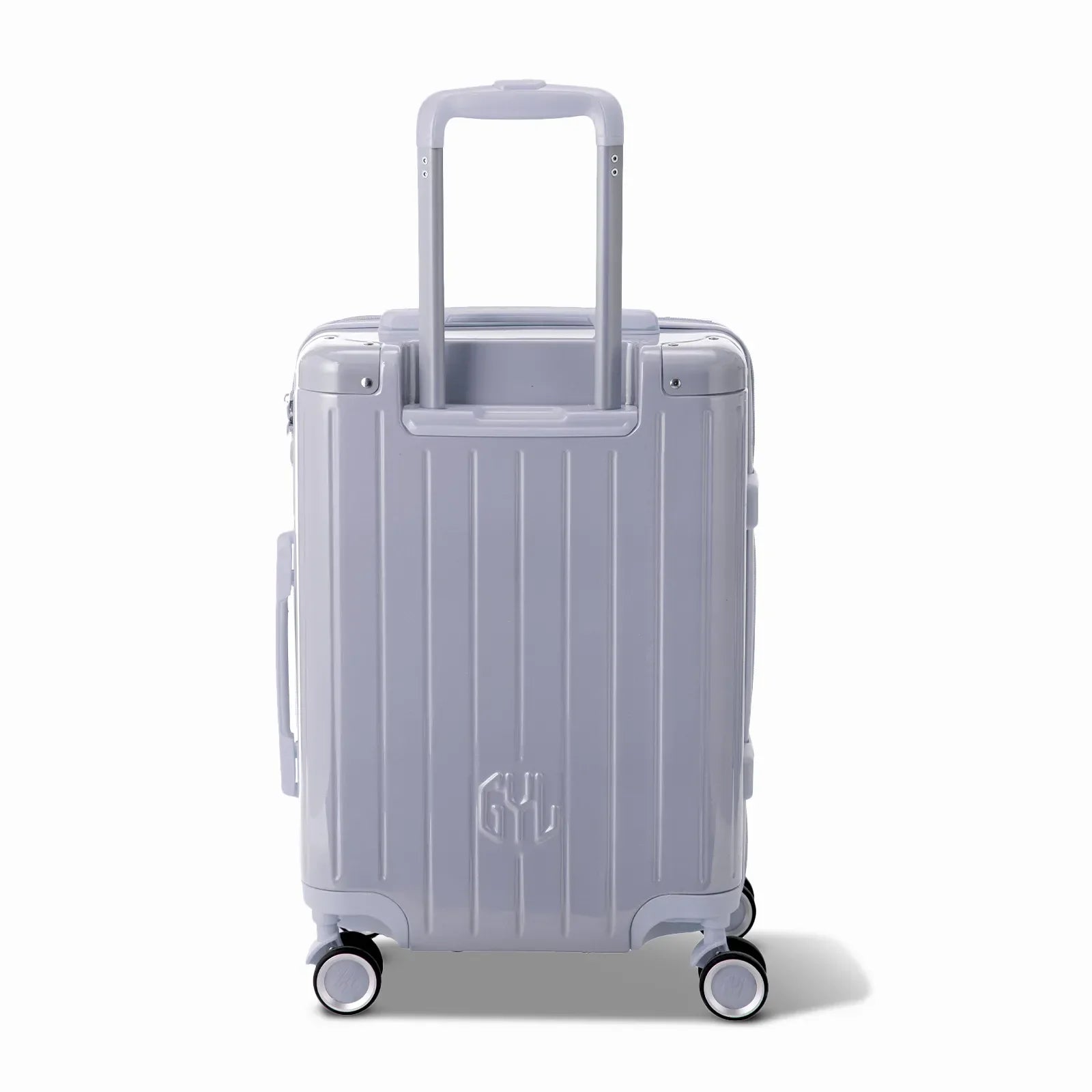 Vue arrière de la valise rigide GYL Intemporelle argent avec poignées intégrées et roulettes pivotantes. #couleur_argent