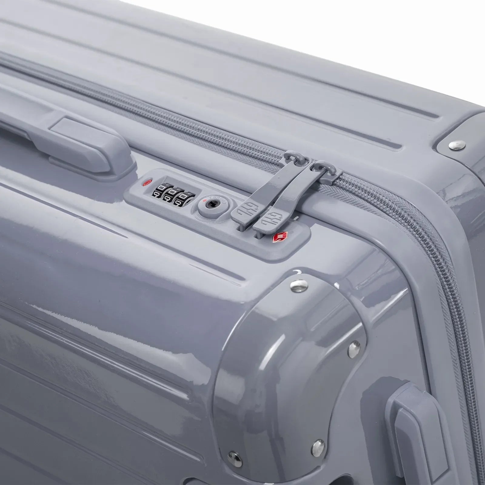 Fermeture à combinaison TSA et double curseur zippé GYL sur la valise rigide argent Intemporelle. #couleur_argent