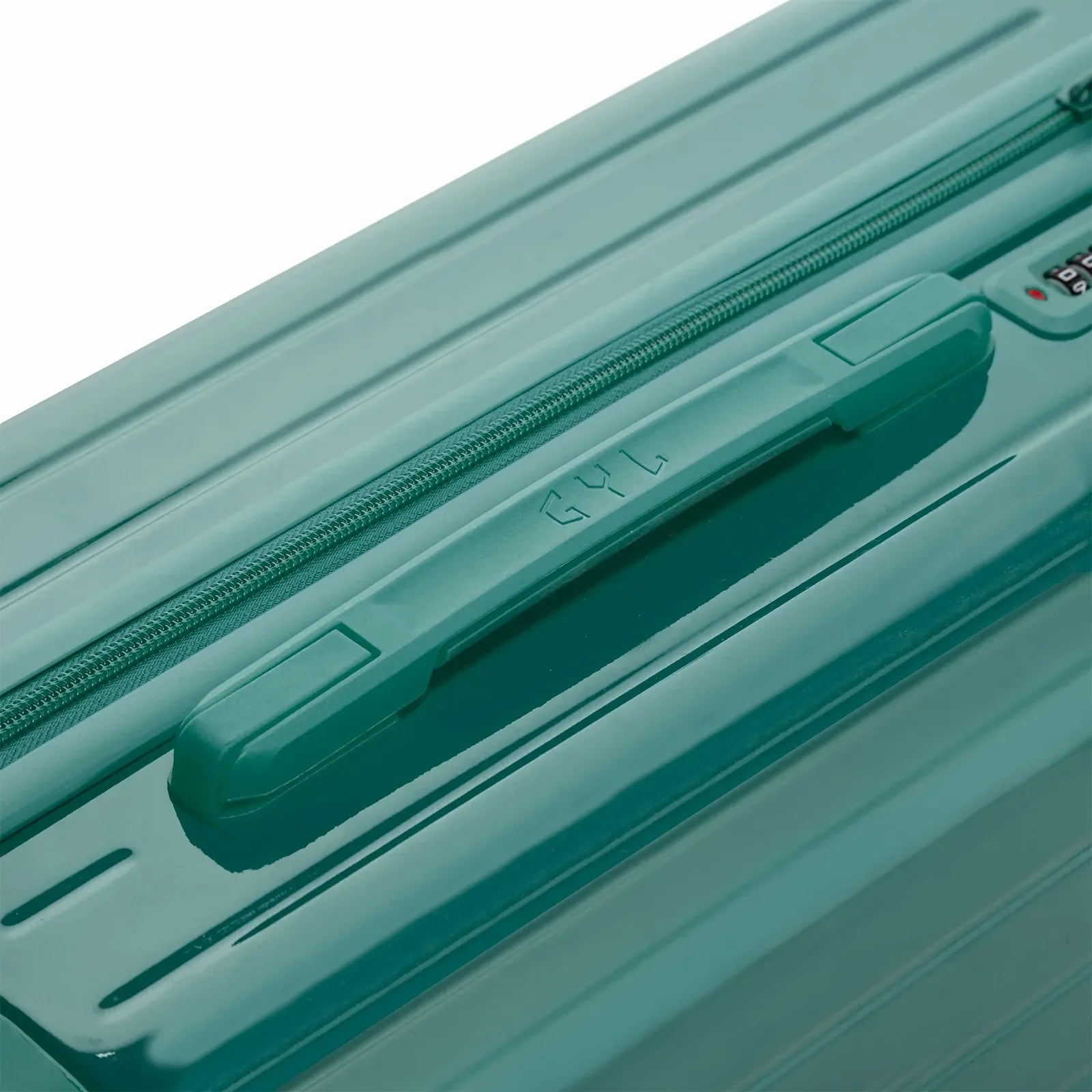 Poignée supérieure rigide de la valise GYL Intemporelle vert d'eau avec logo embossé sur le dessus. #couleur_vert