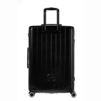 Vue arrière de la valise rigide GYL Intemporelle noir avec poignées intégrées et roulettes pivotantes. #couleur_noir