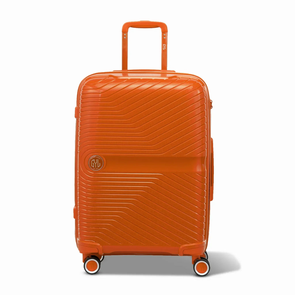 Valise GYL Signature cabine orange en polypropylène vue de face, avec trolley déployé et roues doubles 360° #couleur_orange