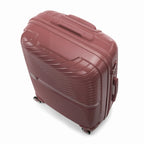 Valise cabine GYL Signature rose gold vue du dessus en diagonale, montrant la poignée supérieure et la structure nervurée. #couleur_rose gold