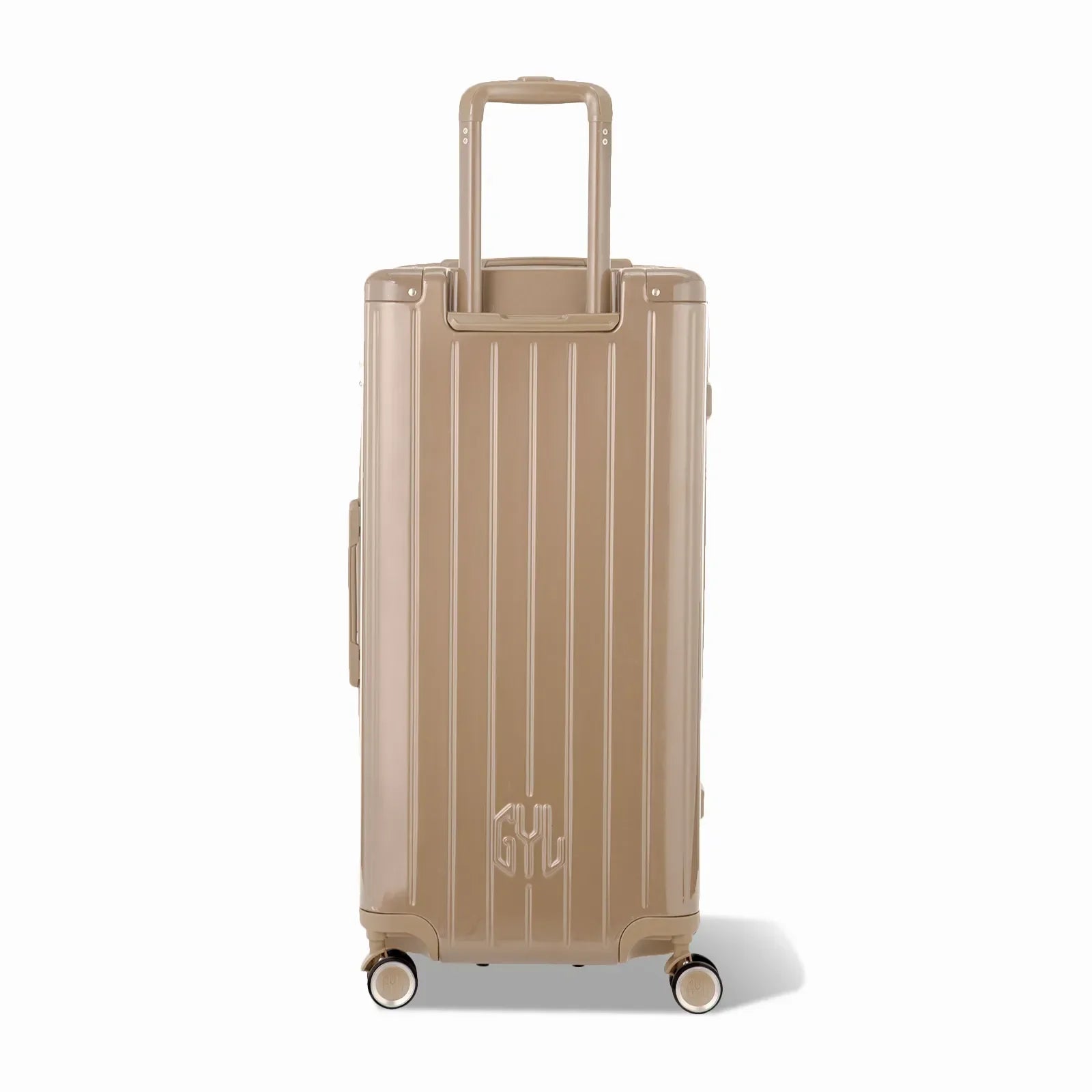 Dos de la valise trunk GYL XL champagne avec trolley télescopique sorti et logo embossé. #couleur_champagne
