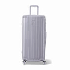 Valise trunk GYL taille XL en polycarbonate argent vue de face, avec trolley déployé et roues 360°. #couleur_argent