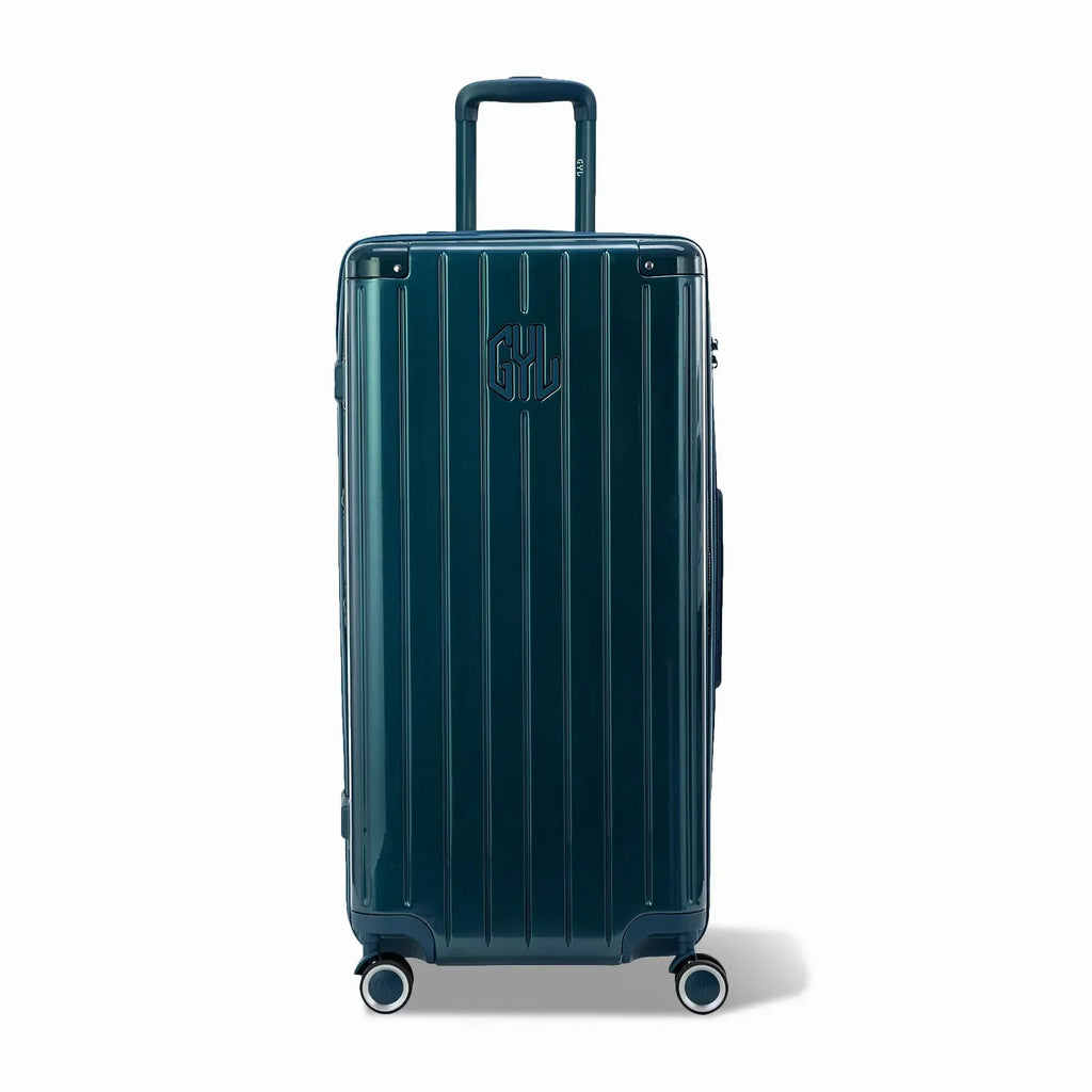 Valise trunk GYL taille XL en polycarbonate sapin vue de face, avec trolley déployé et roues 360°.  #couleur_sapin