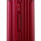 Détail de la serrure TSA et de la poignée latérale sur la valise trunk rouge foncé. #couleur_rouge foncé